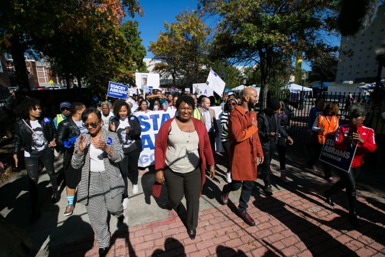 ATLANTA, GA - OCTOBER 28: Democratic Georgia Gubernatorial candidate Stacey Abrams and Grammy-winning artist Common leads voters during a 