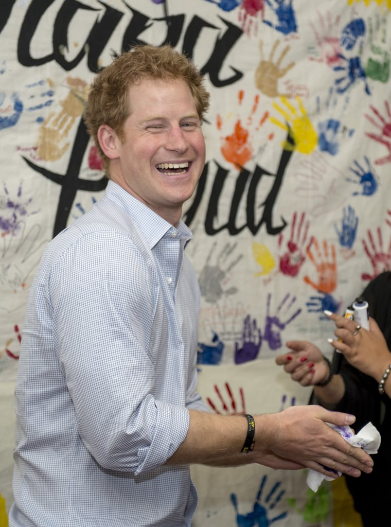 Prince Harry Puts Purple Handprint on Photographer's Head
