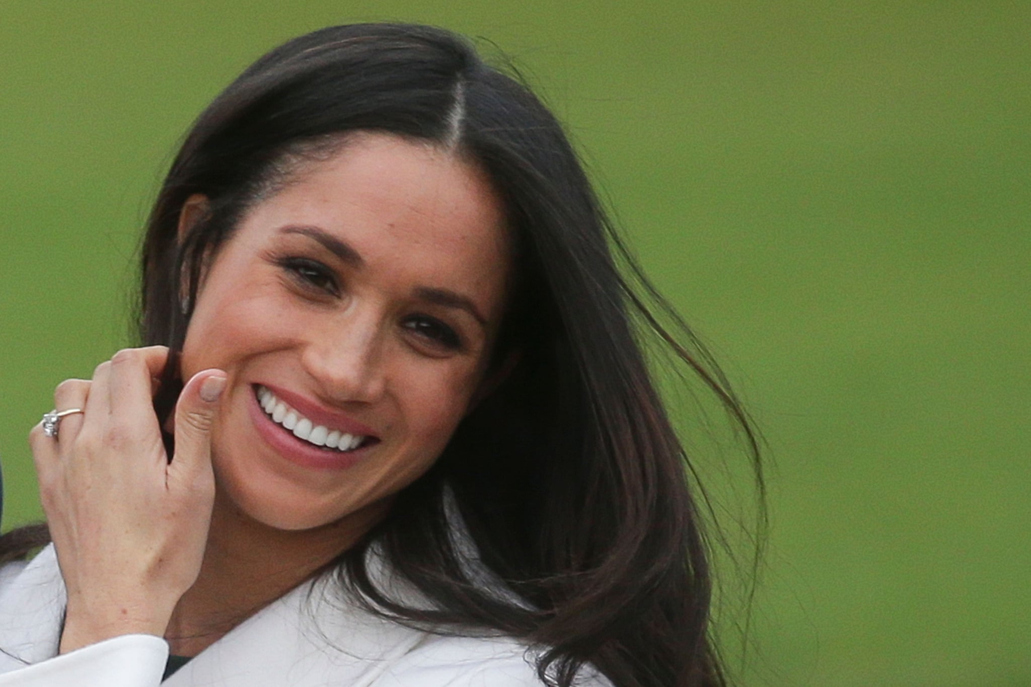 US actress Meghan Markle shows off her engagement ring she poses with her fiancée Britain's Prince Harry in the Sunken Garden at Kensington Palace in west London on November 27, 2017, following the announcement of their engagement.Britain's Prince Harry will marry his US actress girlfriend Meghan Markle early next year after the couple became engaged earlier this month, Clarence House announced on Monday. / AFP PHOTO / Daniel LEAL-OLIVAS        (Photo credit should read DANIEL LEAL-OLIVAS/AFP/Getty Images)