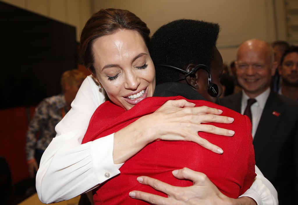 As a UN special envoy, Angelina Jolie embraced Esther Ruth of Uganda during the End Sexual Violence in Conflict summit in London.