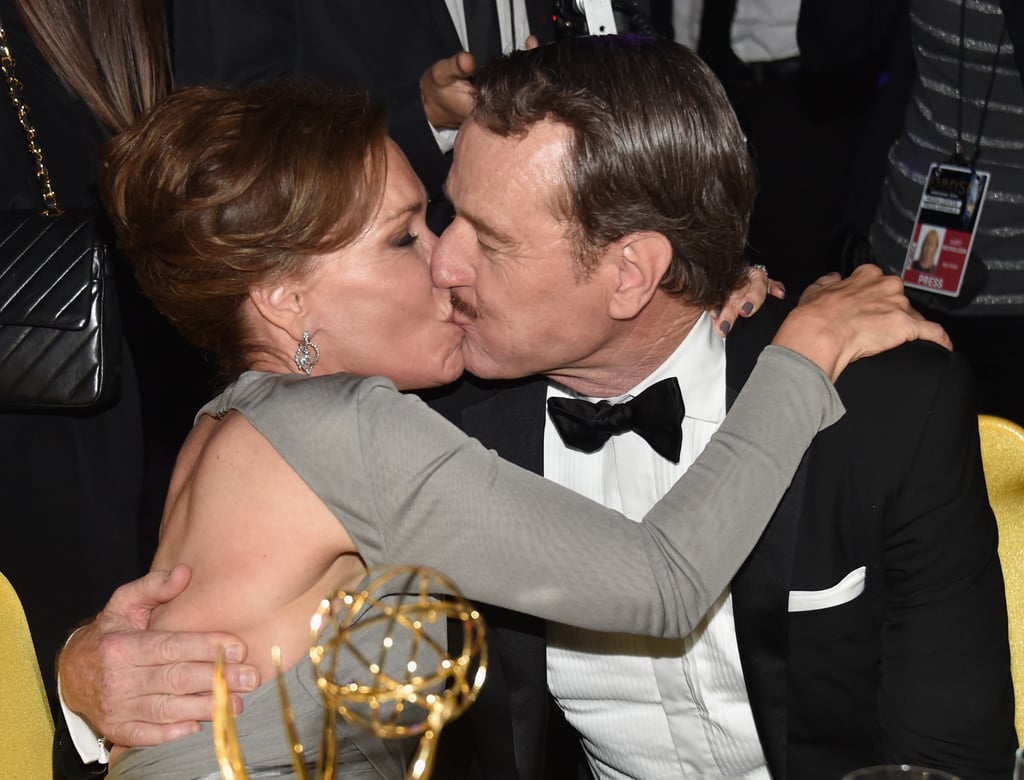 Bryan Cranston planted a kiss on his wife, Robin Dearden, during the Governors Ball.