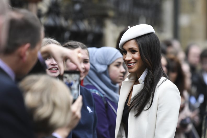 LONDON, ENGLAND - MARCH 12: Meghan Markle and Prince Harry depart from the 2018 Commonwealth Day service at Westminster Abbey and meet waiting school children, on March 12, 2018 in London, England.  (Photo by Steve Back/Getty Images)