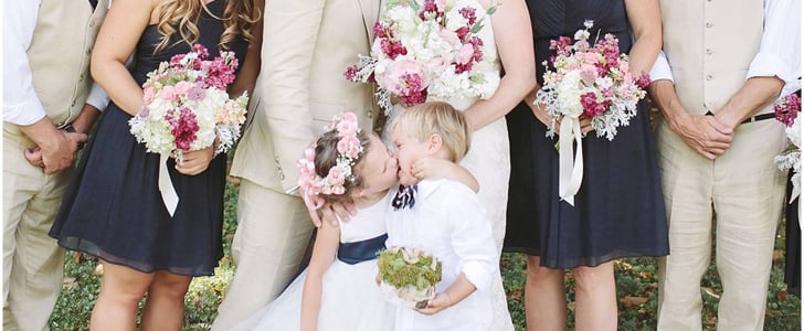 Flower Girl Kisses Ring Bearer in Wedding Photo