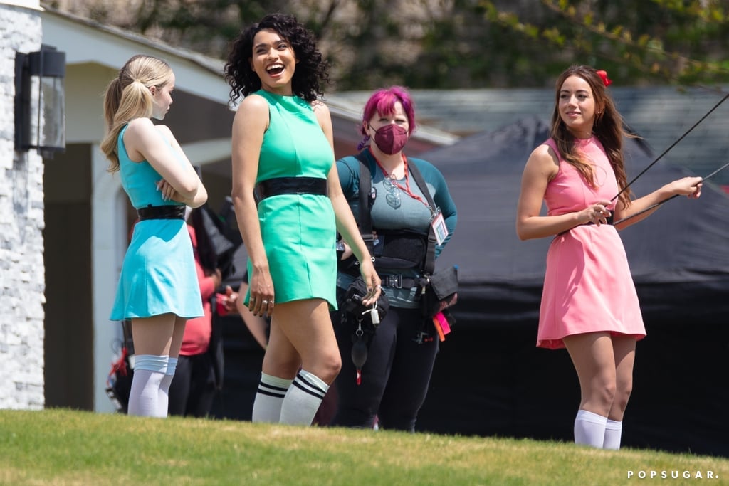 The CW's live-action Powerpuff Girls reboot has officially begun filming, and the colorful superheroes are all grown up. On Wednesday, Chloe Bennet (Blossom), Dove Cameron (Bubbles), and Yana Perrault (Buttercup) were photographed filming the series pilot in Atlanta alongside Donald Faison, who was recently cast as Professor Utonium, and Robyn Lively, who will play Ms. Bellum. The show, based on the Cartoon Network show from the '90s, will show the sisters as "disillusioned 20-somethings who resent having lost their childhood to crime-fighting." 
"Today was my first day ever on TV, for real," Perrault said on her Instagram Stories. "I was on Broad City, but I'm a main character, and that's pretty f*cking special. I happy cried a couple times — so special day!" In a caption on her stories, Perrault added, "Still hasn't fully registered in my head but I'm extremely proud of myself and my girls & our whole f*kin crew [sic]." Cameron also shared photos of her dressing room and director Maggie Kiley even posted a photo of her director's chair from the set on Instagram with the caption, "Day 1!" A premiere date hasn't been released, so in the meantime, check out the photos from the Powerpuff Girls set ahead.

    Related:

            
            
                                    
                            

            Dove Cameron Is Excited to Make the Powerpuff Girls "Real, Fleshed-Out" People