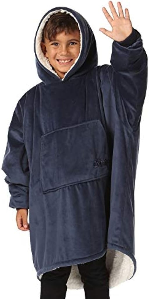 The Comfy Original Jr for Kids Oversized Sherpa Fleece Wearable Blanket ($43)
For the kid who's always parked next to the heater, this ridiculously cozy blanket hoodie will become their weekend uniform. It's oversized, but the ribbed cuffs keep hands comfortably exposed so that it's practical. There's also a huge pocket to keep hands warm.