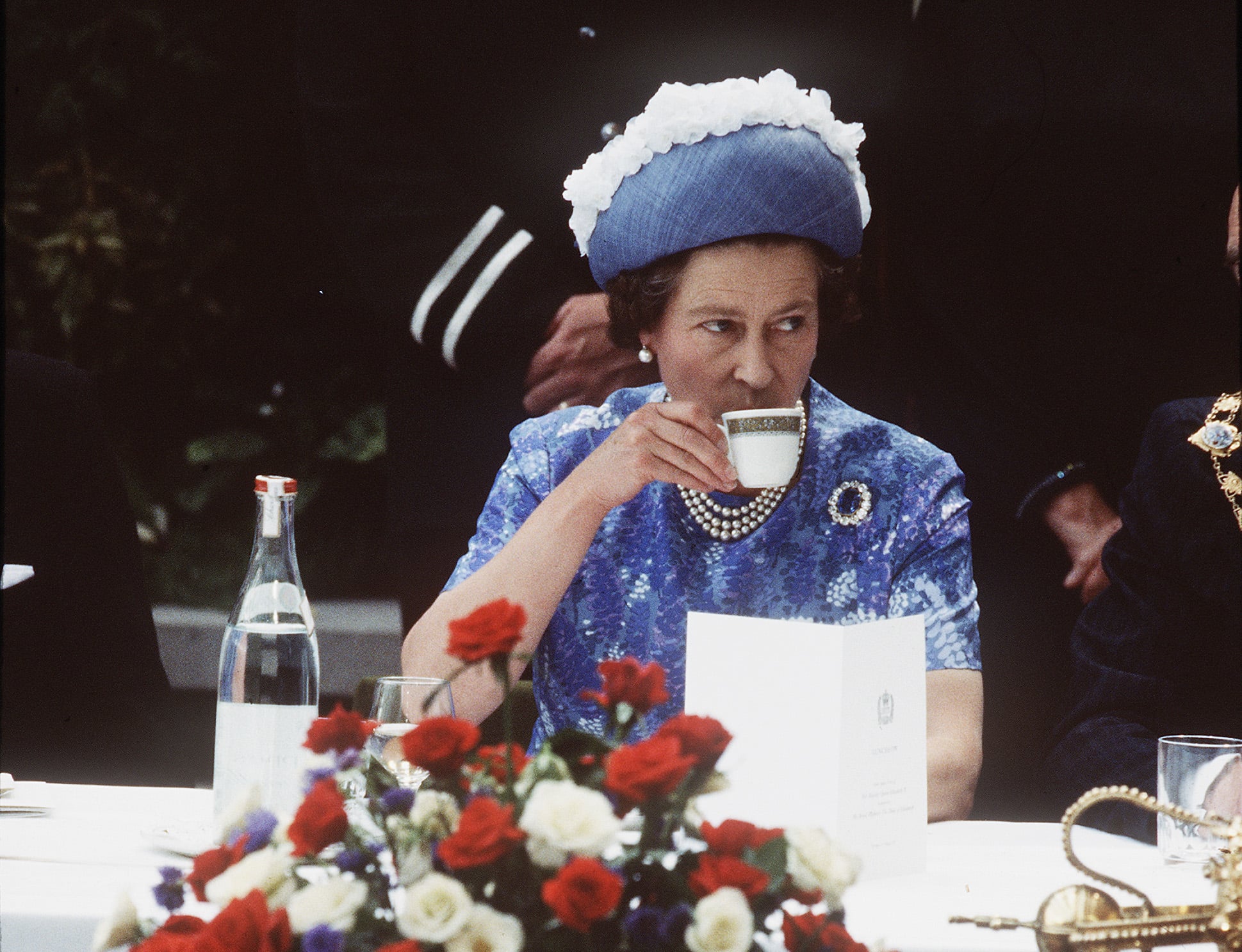 NORTHERN IRELAND - 1977: Queen Elizabeth ll has a cup of tea while in Northern Ireland on a royal visit in 1977.(Photo by Anwar Hussein/Getty Images)