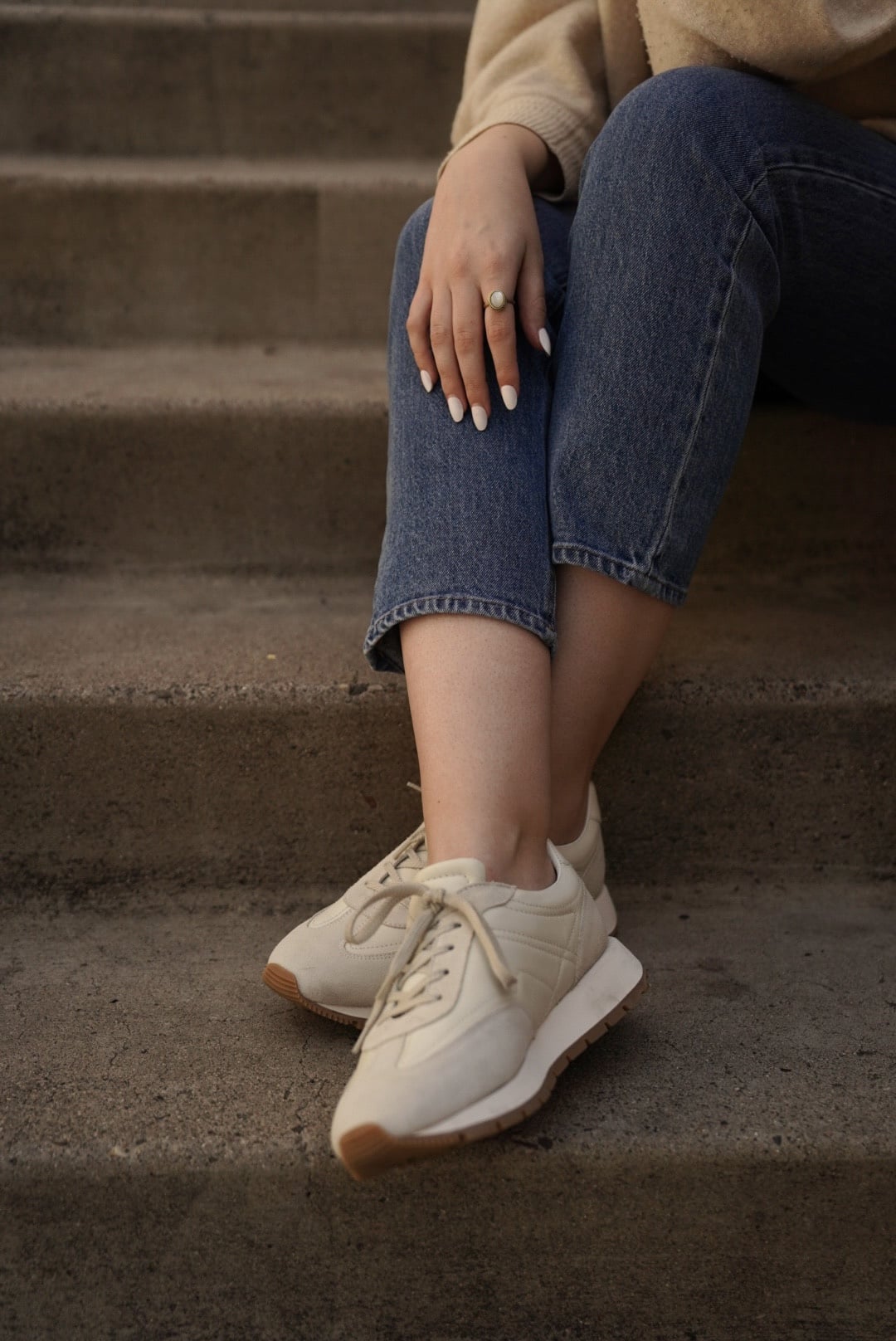 woman wearing Koio Retro Runner Sneakers in Cloud