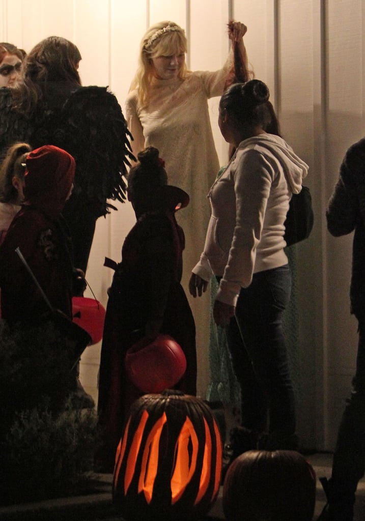 Kirsten Dunst and Garrett Hedlund Handing Out Candy