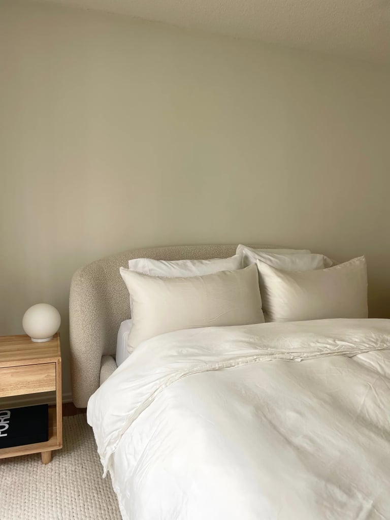 Article Kayra Bed ($1,299)
Article's Kayra Bed has a plush bouclé upholstery that will make your bed look like a cloud. The rounded, sculpted headboard adds to its sophisticated flair. Plus, it's an editor favorite; read our editor's in-depth review of the Kayra Bed for more information.
What we love:
"Not only is this bed frame on trend and chic, but it also goes with the neutral aesthetic of my space perfectly. The design is flawless, and every time someone new comes over to my apartment, they always ask where it's from. Plus, it's comfortable AF. The headboard is cushiony and plush, which makes it perfect for snuggling up against while reading or watching TV." — Renee Rodriguez, staff writer and social producer
Who it's best for:
This bed frame is ideal for anyone looking for something neutral-toned with texture.
It also features a seven-inch, under-bed clearance, which is great for additional storage needs.
Who should avoid it:
The bed frame requires assembly and a few helping hands as well. Our editor recommends the "inside + assembly" option for those who don't want to assemble it themselves.
The Details: Material: Bouclé | Sizes: Queen and king | Color Options: 2