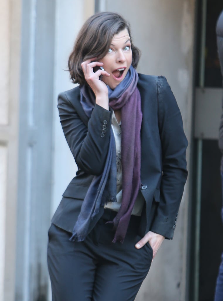 Milla Jovovich stuck a care-free pose on the set of her new political thriller, Survivor, which also stars Dylan McDermott, in London on Tuesday.