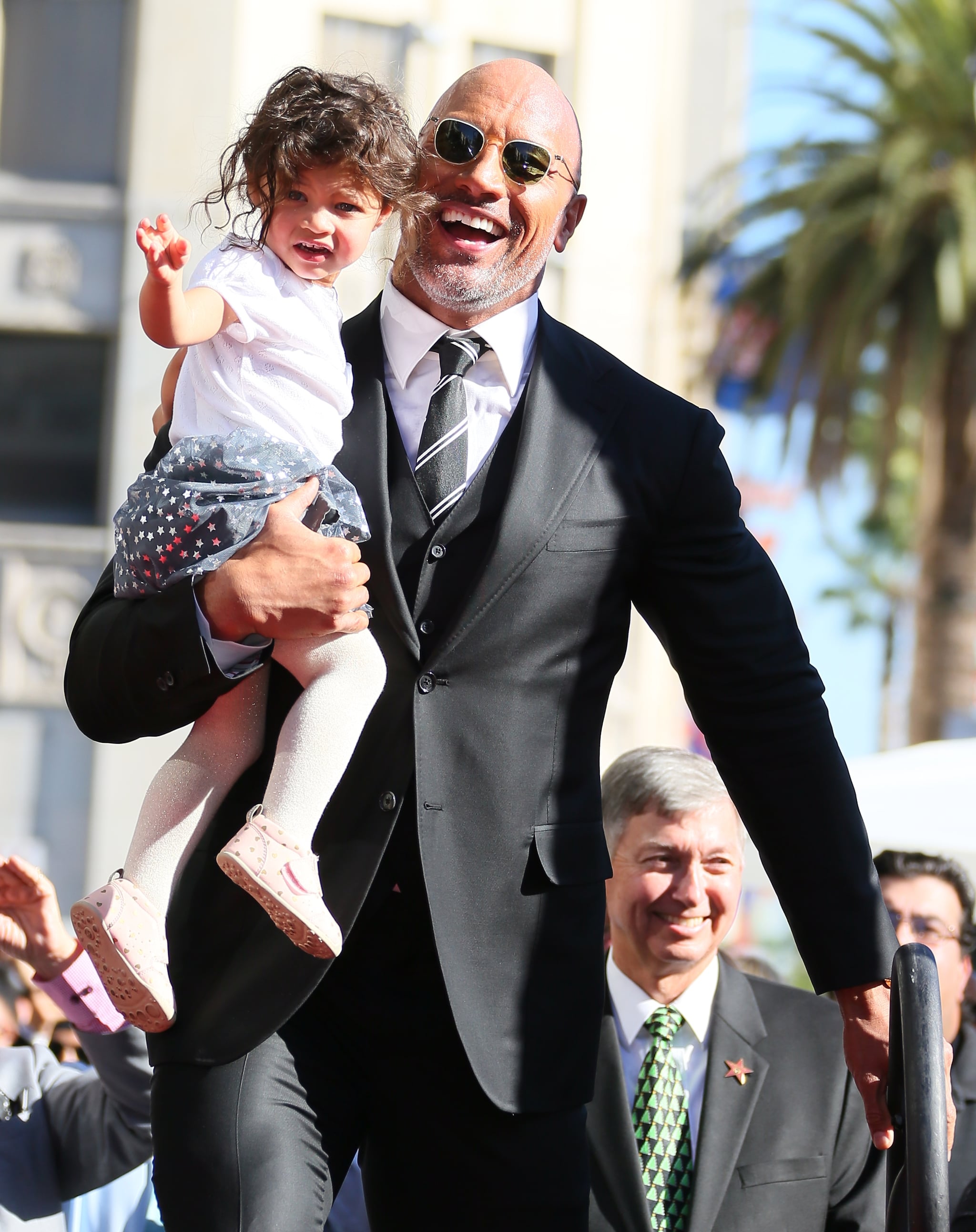 LOS ANGELES, CA - DECEMBER 13: Dwayne Johnson and daughter Jasmine Johnson attends a ceremony honouring him with a star on The Hollywood Walk of Fame on December 13, 2017 in Los Angeles, California.(Photo by JB Lacroix/ WireImage)