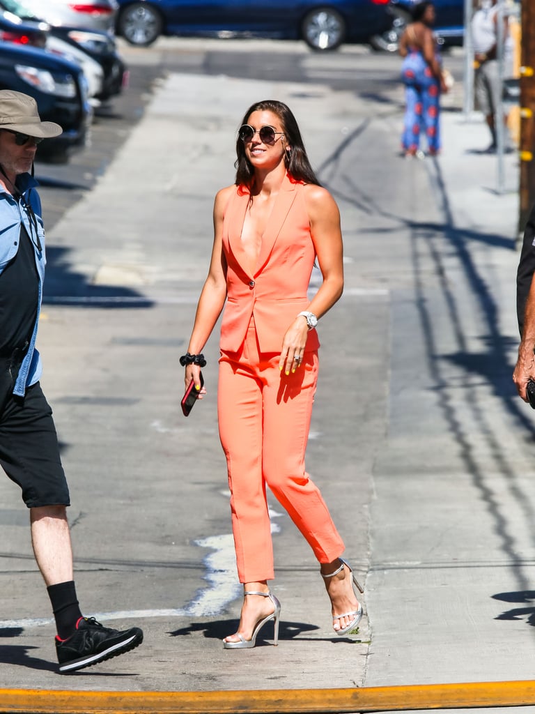 Alex Morgan's Orange Suit and Silver Heels July 2019