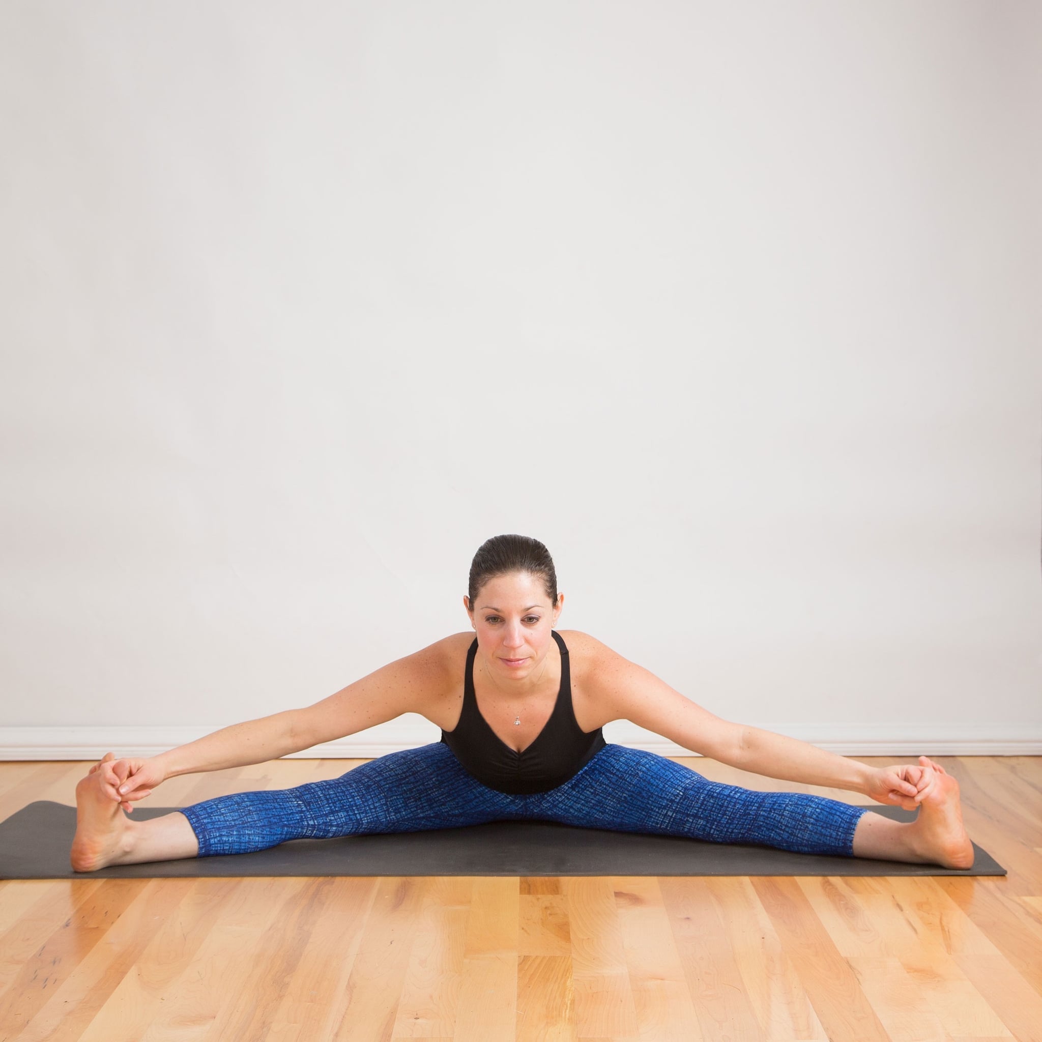 Seated Straddle | Ease That Aching Back With These Soothing Yoga Poses |  POPSUGAR Fitness Photo 8