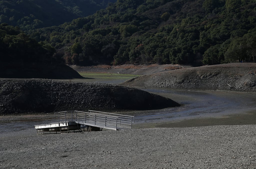 A boat dock sits on the dry ground at Steven Creek Reservoir in Cupertino, CA.