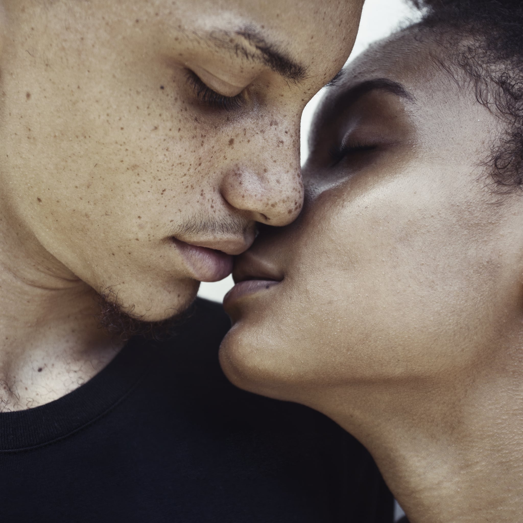 Black Couple Close to Kissing and Touching Lips 