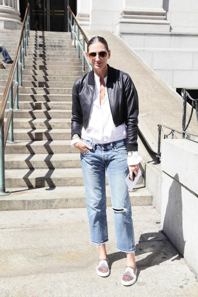 Casual Jenna mixed basics you likely have at home — relaxed boyfriend jeans, a leather jacket, and comfy kicks.