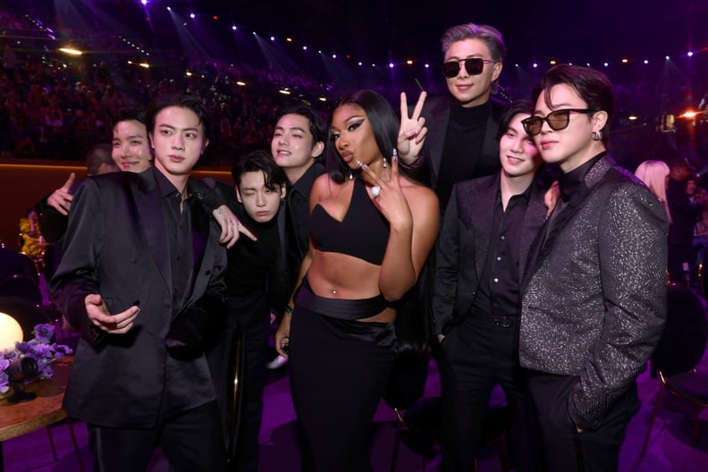 LAS VEGAS, NEVADA - APRIL 03: Megan Thee Stallion (C) and (from L) J-Hope, Jin, Jungkook, V, RM, Suga, and Jimin of BTS attend the 64th Annual GRAMMY Awards at MGM Grand Garden Arena on April 03, 2022 in Las Vegas, Nevada. (Photo by Emma McIntyre/Getty Im