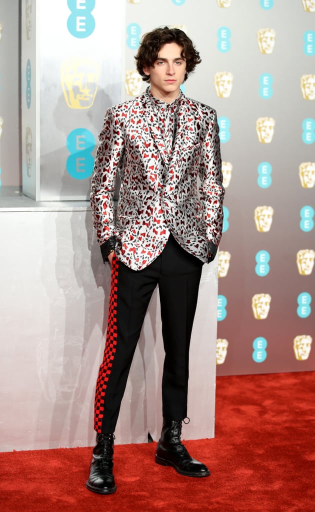 Timothée's look at the 2019 EE British Academy Film Awards consisted of a printed Haider Ackermann suit with checkerboard-striped trousers.