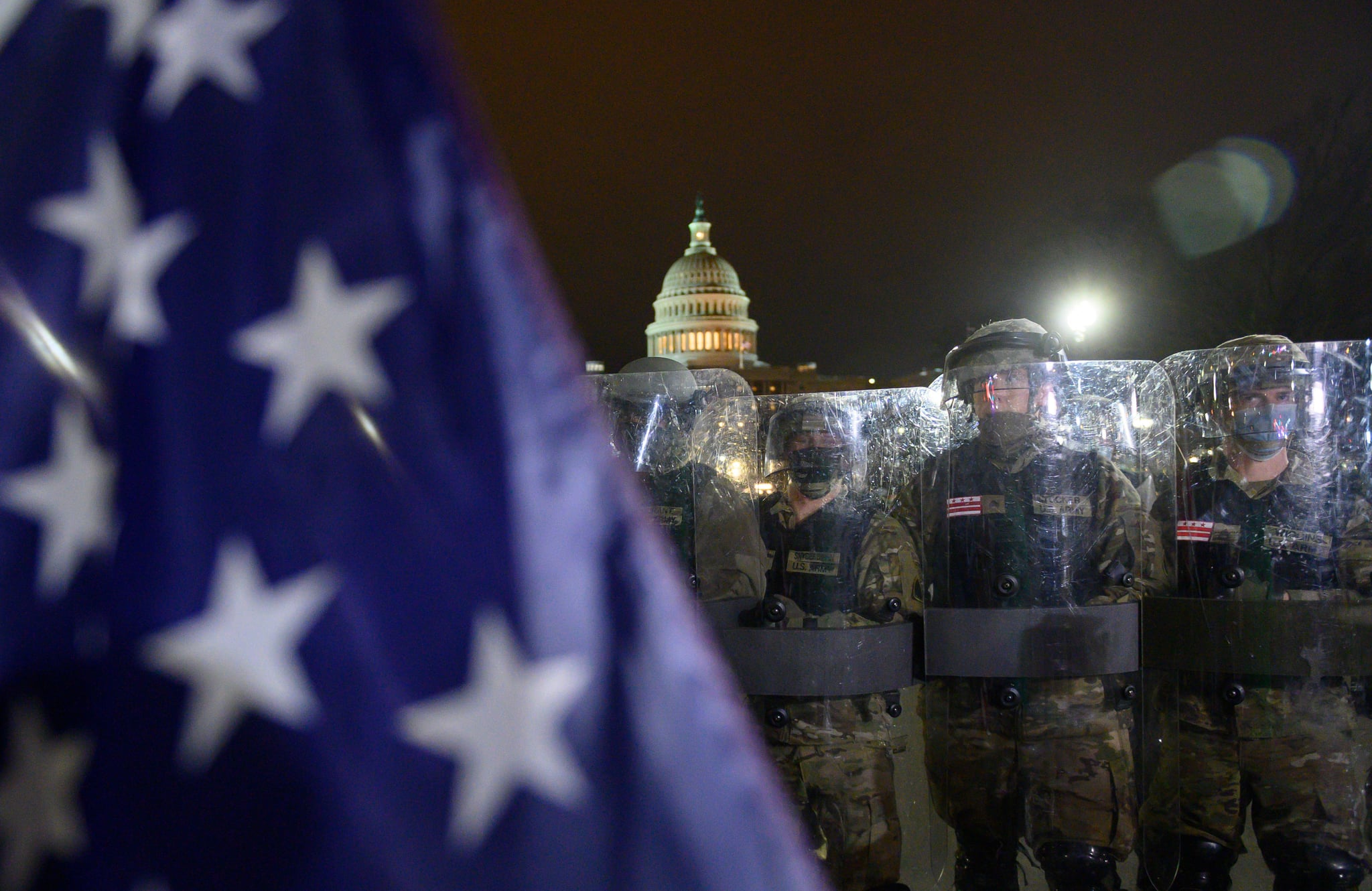 Members of the DC National Guard are deployed outside of the US Capitol in Washington DC on January 6, 2021. - Trump supporters remain outside, defying a 6.00 pm (2300 GMT) curfew imposed across the city by Mayor Muriel Bowser.Donald Trump's supporters stormed a session of Congress held today, January 6, to certify Joe Biden's election win, triggering unprecedented chaos and violence at the heart of American democracy and accusations the president was attempting a coup. (Photo by Andrew CABALLERO-REYNOLDS / AFP) (Photo by ANDREW CABALLERO-REYNOLDS/AFP via Getty Images)