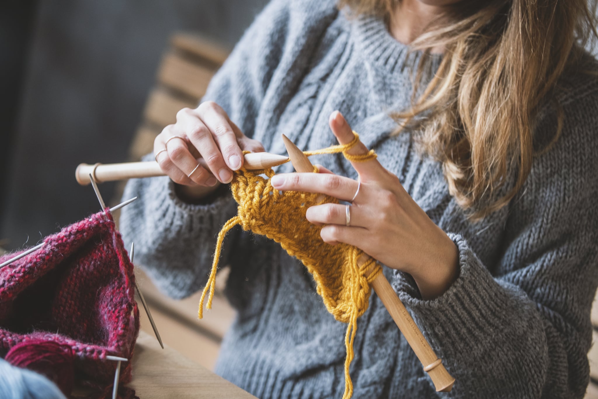 Close up on woman's hands knitting