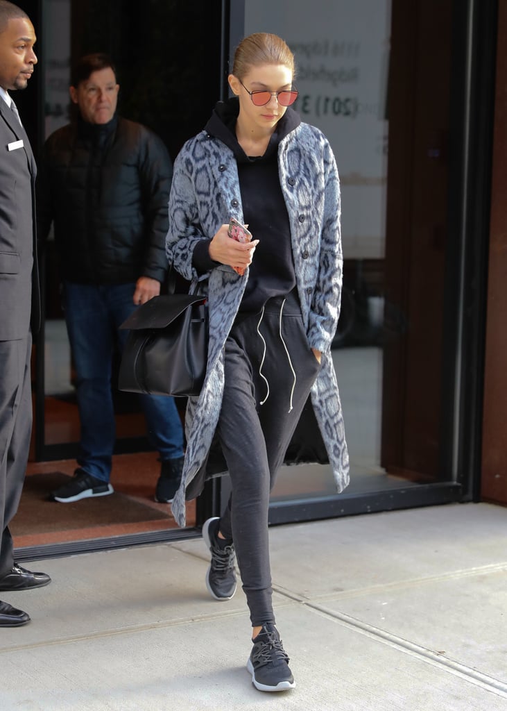 Gigi Hadid took her athleisure to the streets with an Elizabeth and James blue leopard coat.