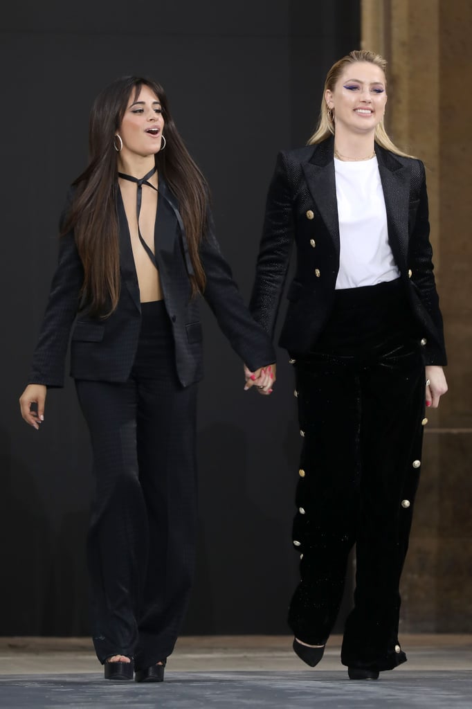 Camila walked the runways hand-in-hand with actress and model Amber Heard, who wore a military-style pantsuit covered head-to-toe in glitter.