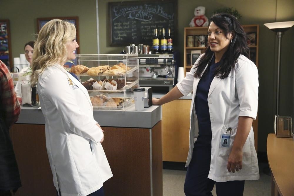 The two doctors take a minute by the pastries.