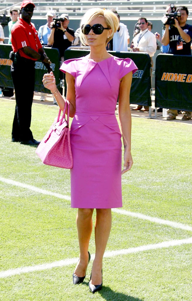 Wearing a hot-pink Roland Mouret dress and matching Birkin bag at David Beckham's Galaxy conference in July 2007.