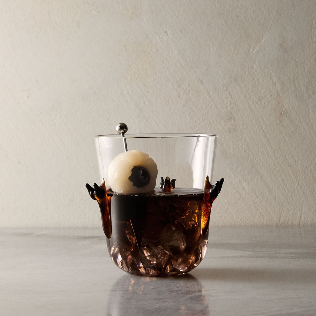 West Elm Halloween Antics Double Old Fashioned Glass Set ($36, originally $60)
Wow guests with these eerie glasses. The double old-fashioned glass is adorned with colorful slug accents to create a haunted finish. It's perfect for a gothic dinner party. Stock up on a set of four or eight for all your hosting needs.