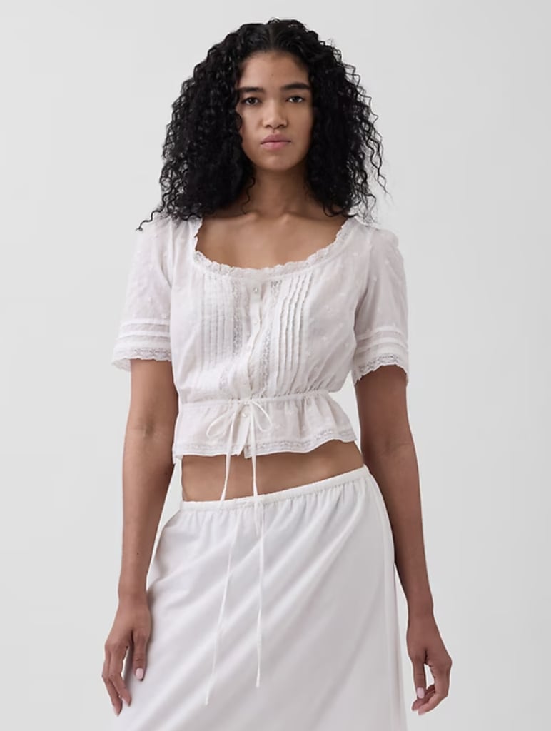Gap Lace-Trim Peplum Top ($55, originally $70)
Durran drew references from many places for her costume design, including the novel's late 18th century setting. This period dates the pre-Victorian era, which was often marked by puffed sleeves, lace-trim frocks, and scooped tops with off-the-shoulder necklines. This peplum top from Gap is equal parts vintage yet modern thanks to its scoop neck and dainty hem.