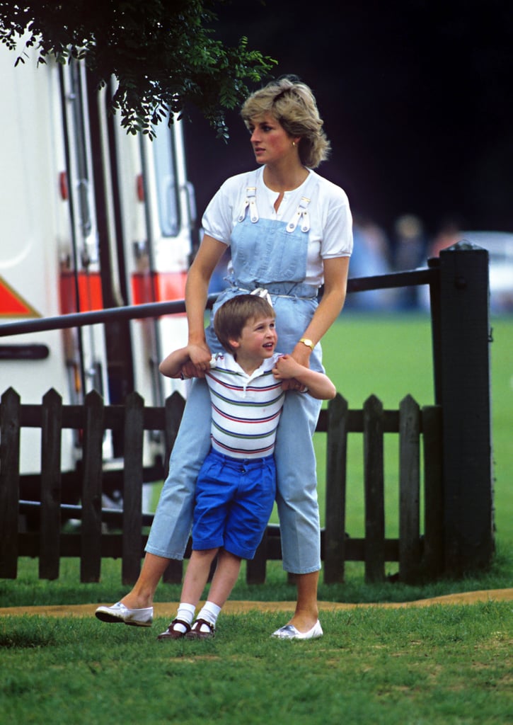 Playing with Prince William at a polo match, Diana donned light blue denim dungarees featuring white straps, paired with a white buttoned tee and loafers.