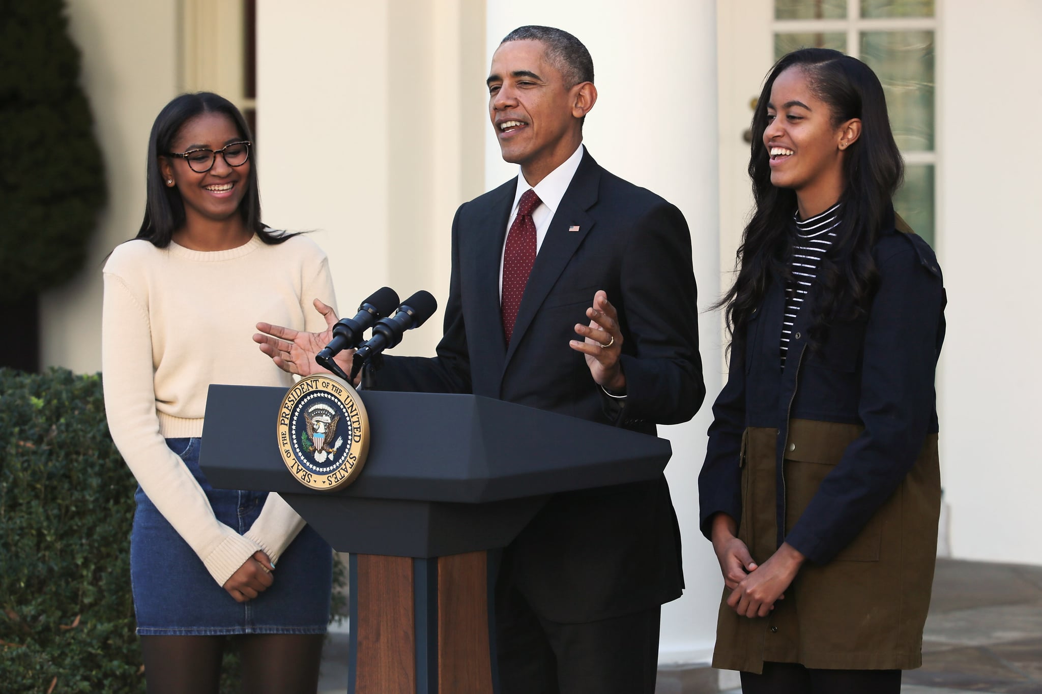 WASHINGTON, DC - NOVEMBER 25:  U.S. President Barack Obama delivers remarks with his daughters Sasha (L) and Malia during the annual turkey pardoning ceremony in the Rose Garden at the White House  November 25, 2015 in Washington, DC. In a tradition dating back to 1947, the president pardons a turkey, sparing the tom -- and his alternate -- from becoming a Thanksgiving Day feast. This year, Americans were asked to choose which of two turkeys would be pardoned and to cast their votes on Twitter.  (Photo by Chip Somodevilla/Getty Images)