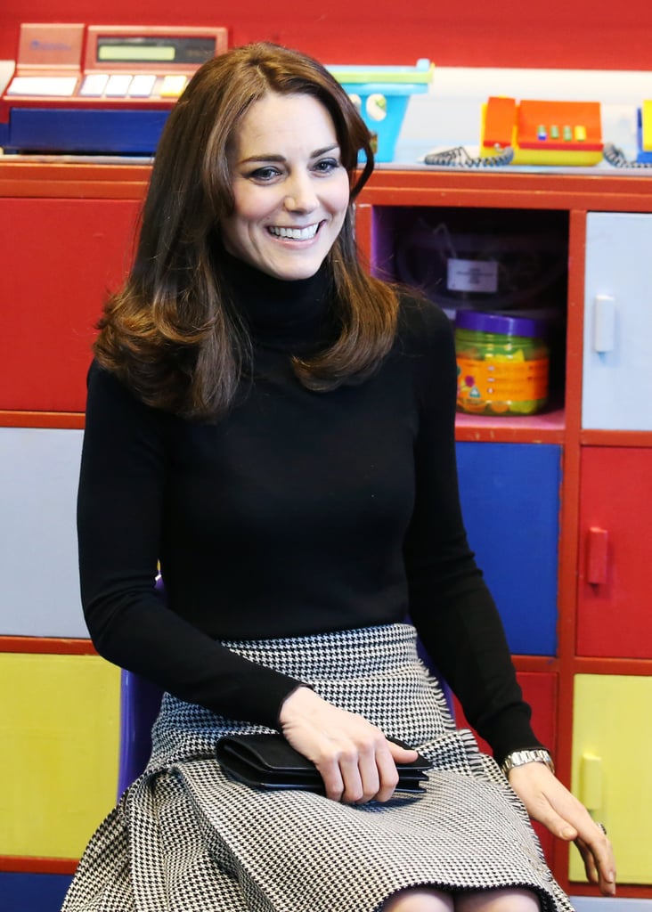 Kate's outfit consisted of a black turtleneck, checked skirt by Le Kilt, and a Mulberry clutch.