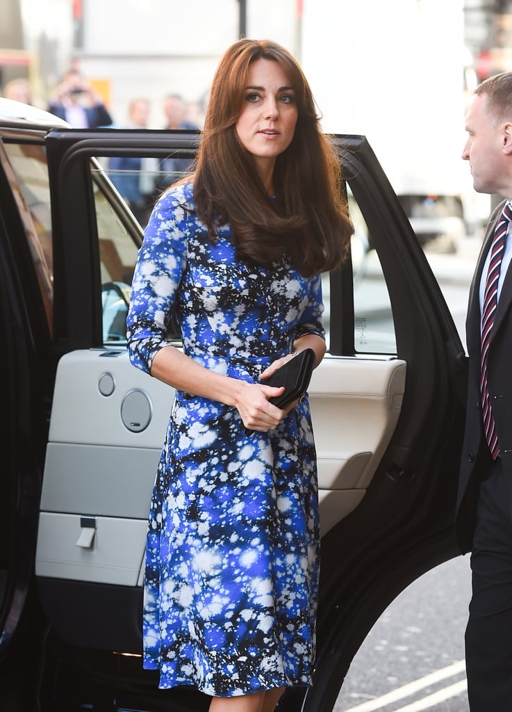 Kate held onto a leather envelope clutch.