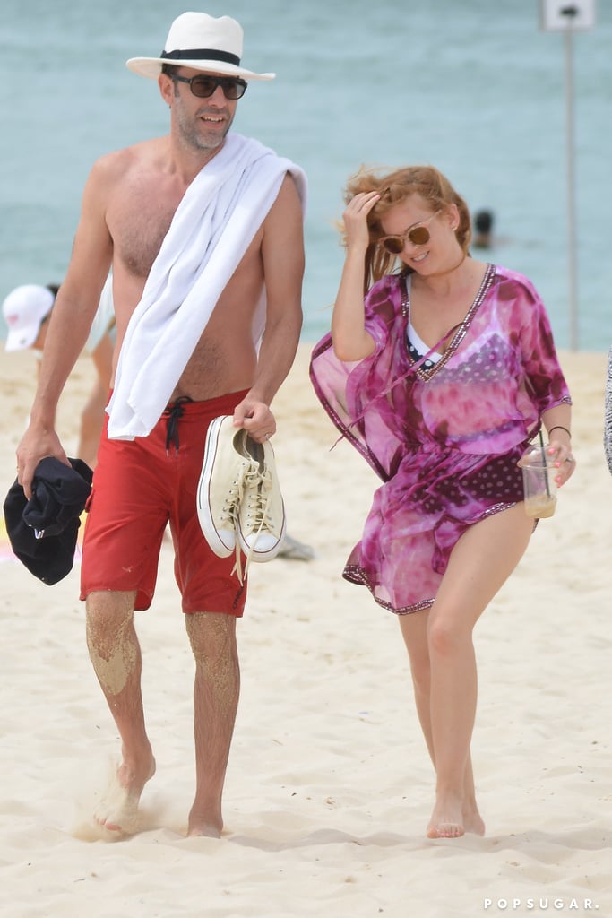 Sacha Baron Cohen and Isla Fisher hit up Bondi Beach in Australia on Tuesday. The couple, who celebrated six years of marriage this year, kicked back and relaxed on the sand and enjoyed the beautiful ocean view. Sacha went shirtless in a pair of red board shorts and at one point was spotted taking a dip in the ocean. Clad in a blue polka-dot bikini and magenta swimsuit cover-up, Isla basked in the sun and cooled herself down with an ice-cold drink. The couple's getaway is a nice break for Sacha, who is likely prepping for his upcoming role in Mandrake the Magician. 

    Related:

            
            
                                    
                            

            Isla Fisher and Sacha Baron Cohen Escape to Cannes For Some Quality R&R on a Yacht