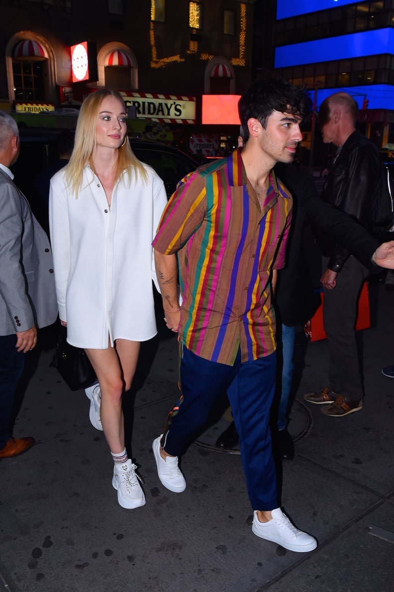 Sophie Turner in an Oversize White Button-Down and Sneakers in 2019
