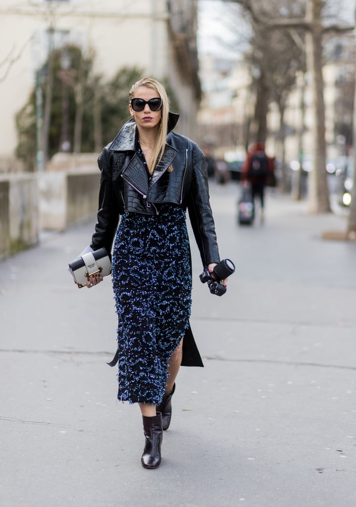 You likely have a leather jacket, so consider wearing that over a navy maxi dress. This street style star kept her look interesting with textures in both pieces, and it doesn't hurt to accessorize with a designer Prada clutch.