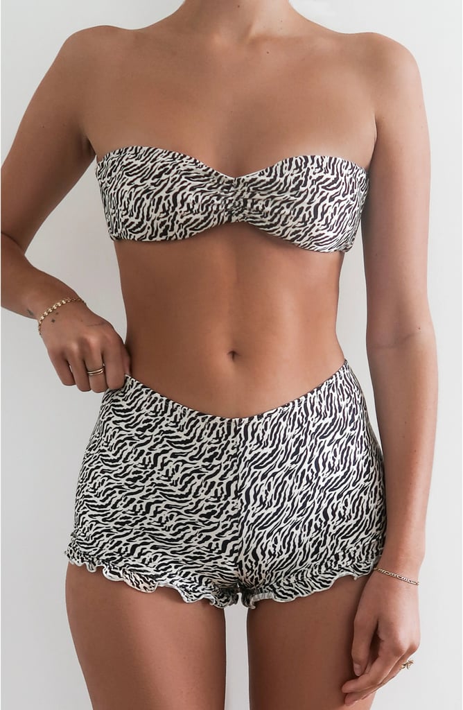 Dippin Daisys Rebel Shorts ($56)
Whether you're in between waxes or laser sessions or just want a bit more bottom coverage, these swim shorts couldn't be cuter. They feature a ruffled hem and would look great paired with practically any two-piece top you own, whether it's a neon option for contrast or a coordinating black bikini top.