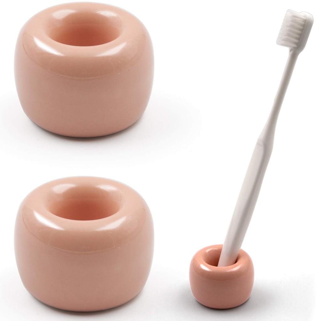 The peach colour of the Airmoon Mini Ceramics Handmade Toothbrush Holder ($10, pack of two) is pretty, too.