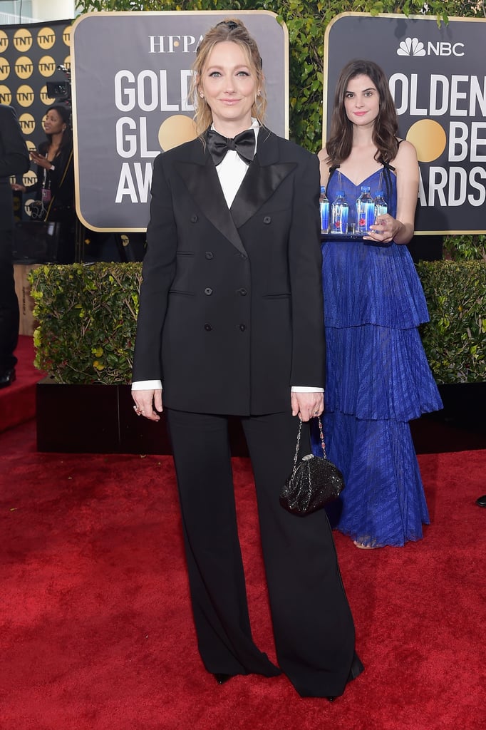 Also, can we discuss how perfectly her dress and lipstick match the Fiji bottles?