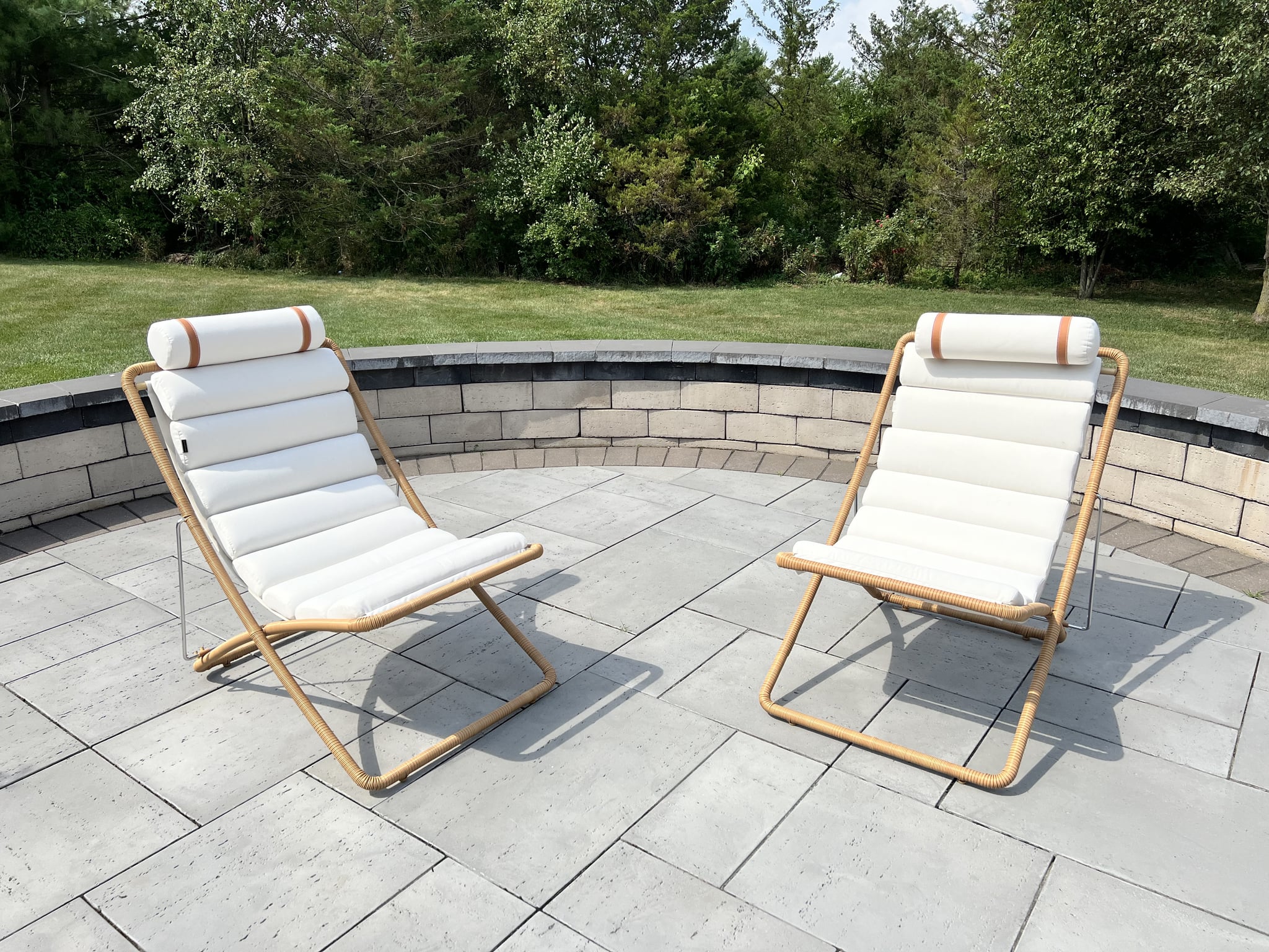 Two Rove Concepts Jericho Sling Chair on patio outdoors.