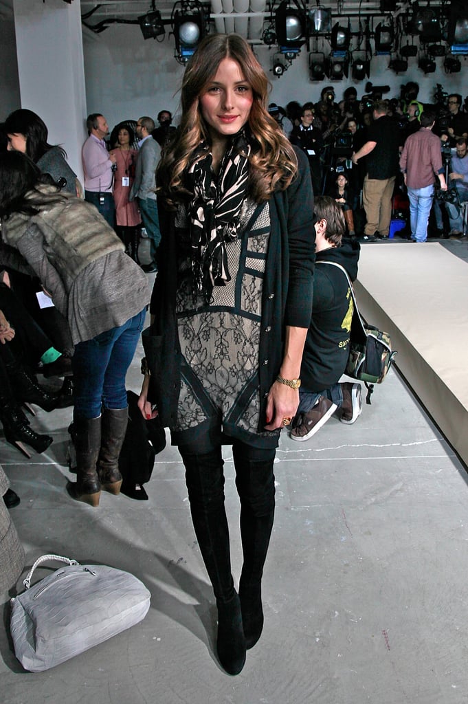 Layering up a Preen lace dress at Fashion Week in February 2010.