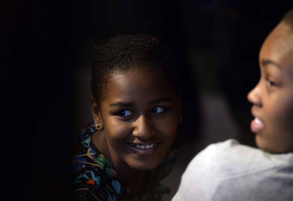 Sasha Obama smiled from the audience while First Lady Michelle Obama spoke with students in Johannesburg in June 2013.