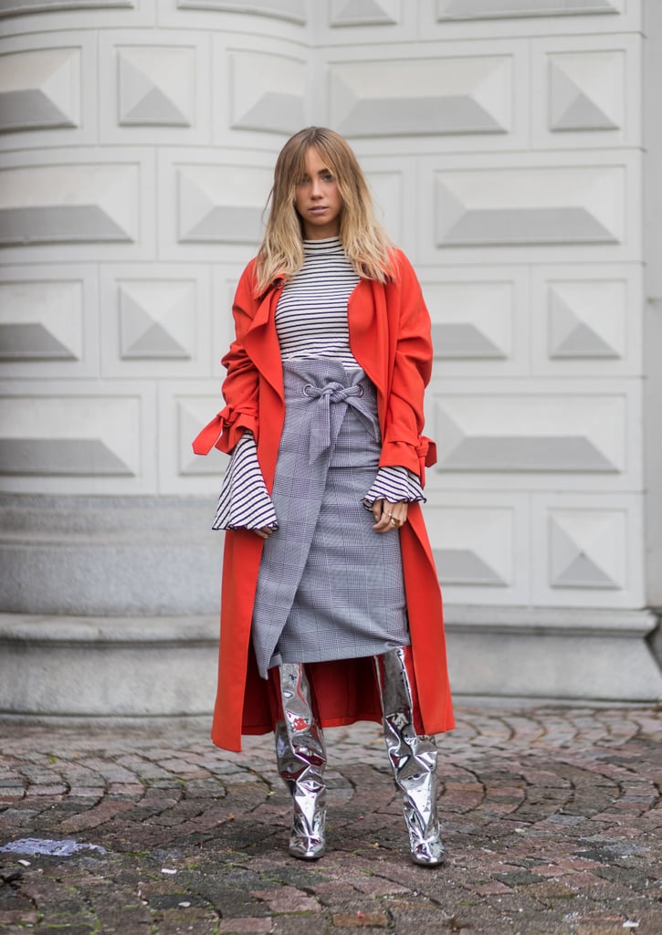 Top off your stripes with a checked wrap skirt in shades of gray, then throw on a pair of statement boots and some bright outerwear.
