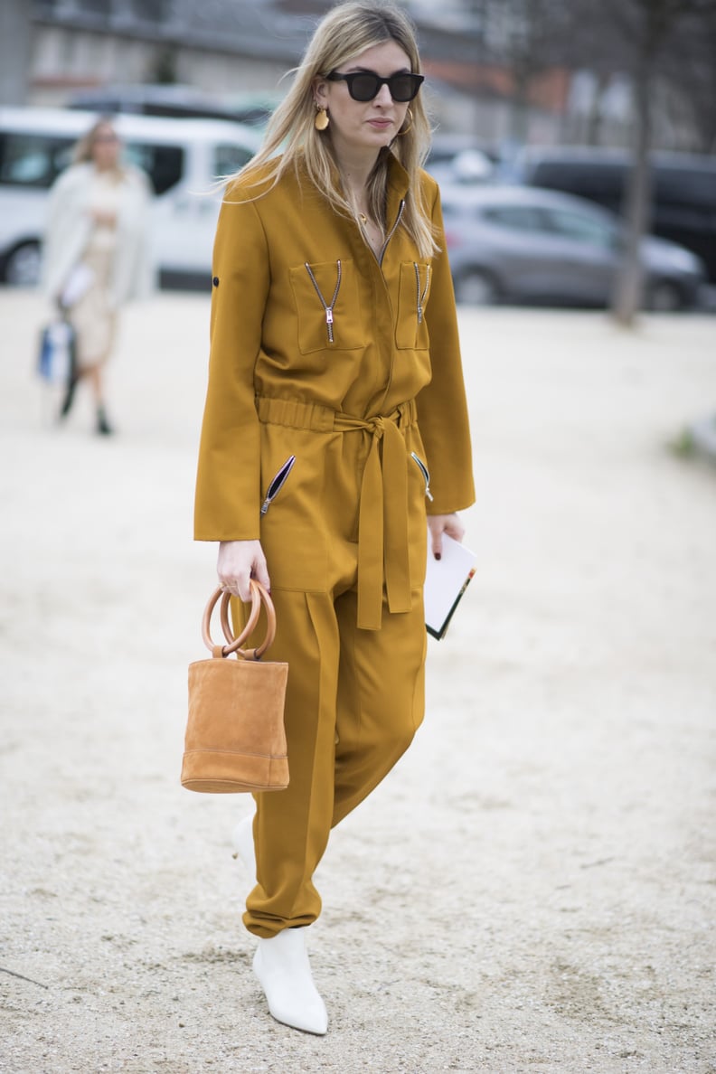 Give Your Boiler Suit a Feminine Look With White Heels and a Bucket Bag