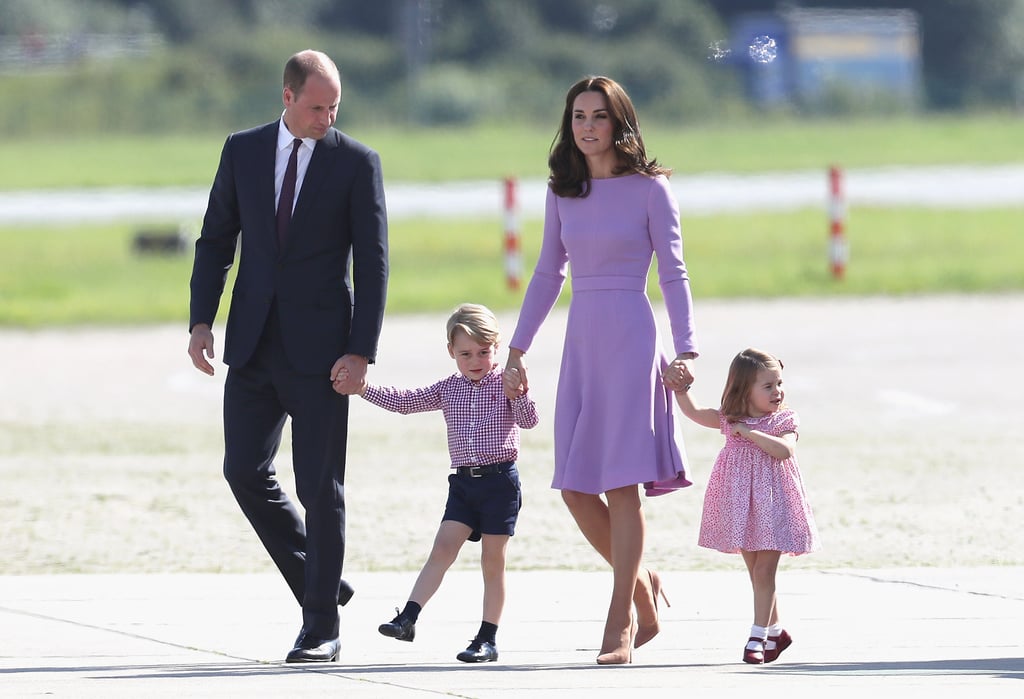 Before departing Germany in July 2017, George and Charlotte donned color-coordinated red outfits while viewing helicopters at the Hamburg airport. George sported a red gingham shirt, and Charlotte looked adorable in a red floral dress.