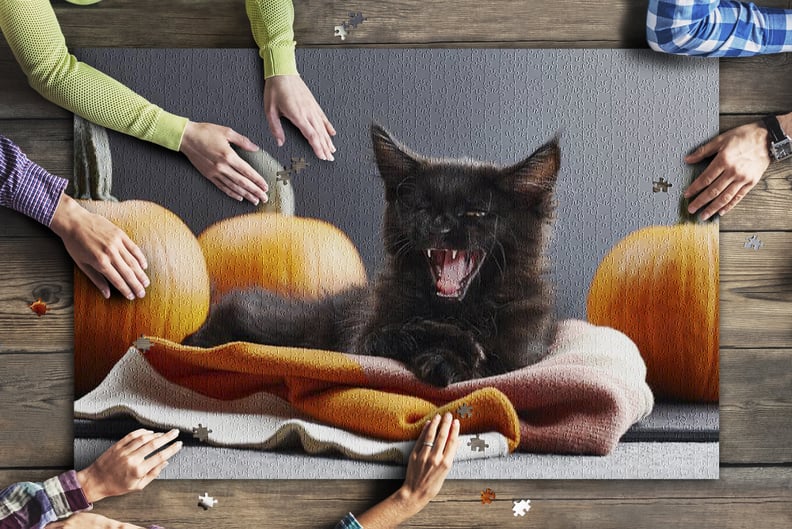 Halloween Concept with Black Cat Surrounded by Pumpkins Puzzle