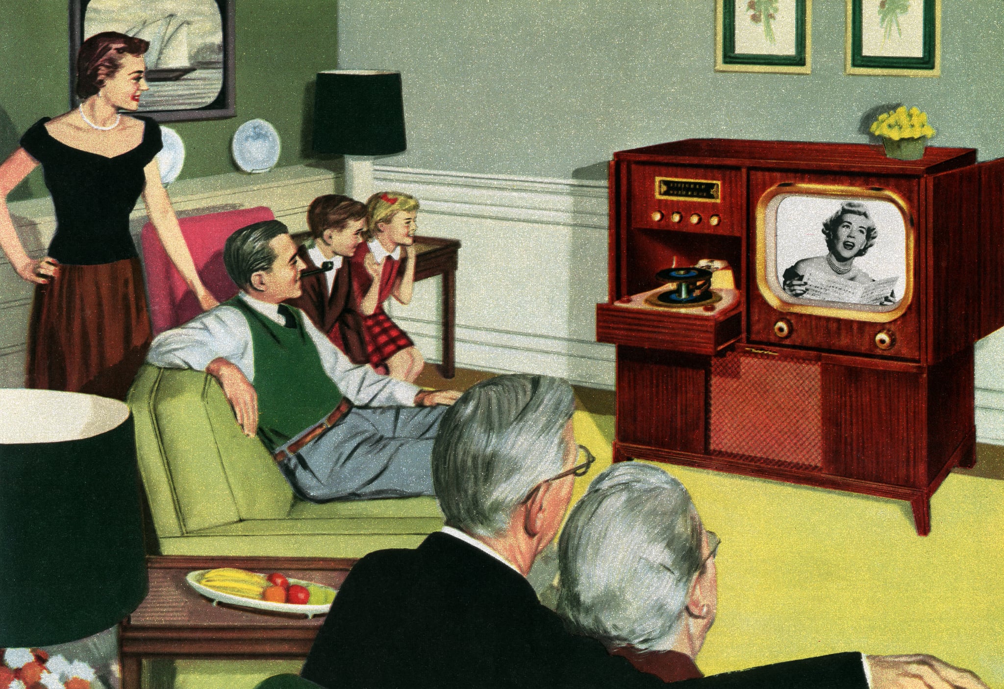 Vintage illustration of three generations of a 1950s American family, sitting in their living room watching television (screen print), 1950. (Photo by GraphicaArtis/Getty Images)