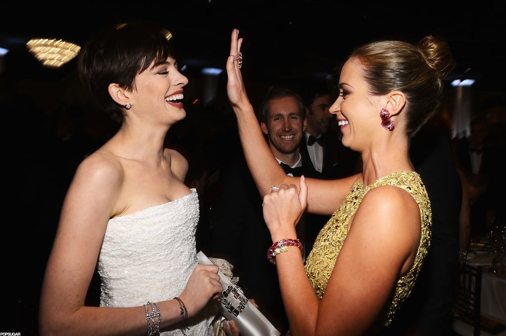 Anne Hathaway and Emily Blunt shared a laugh in 2013.