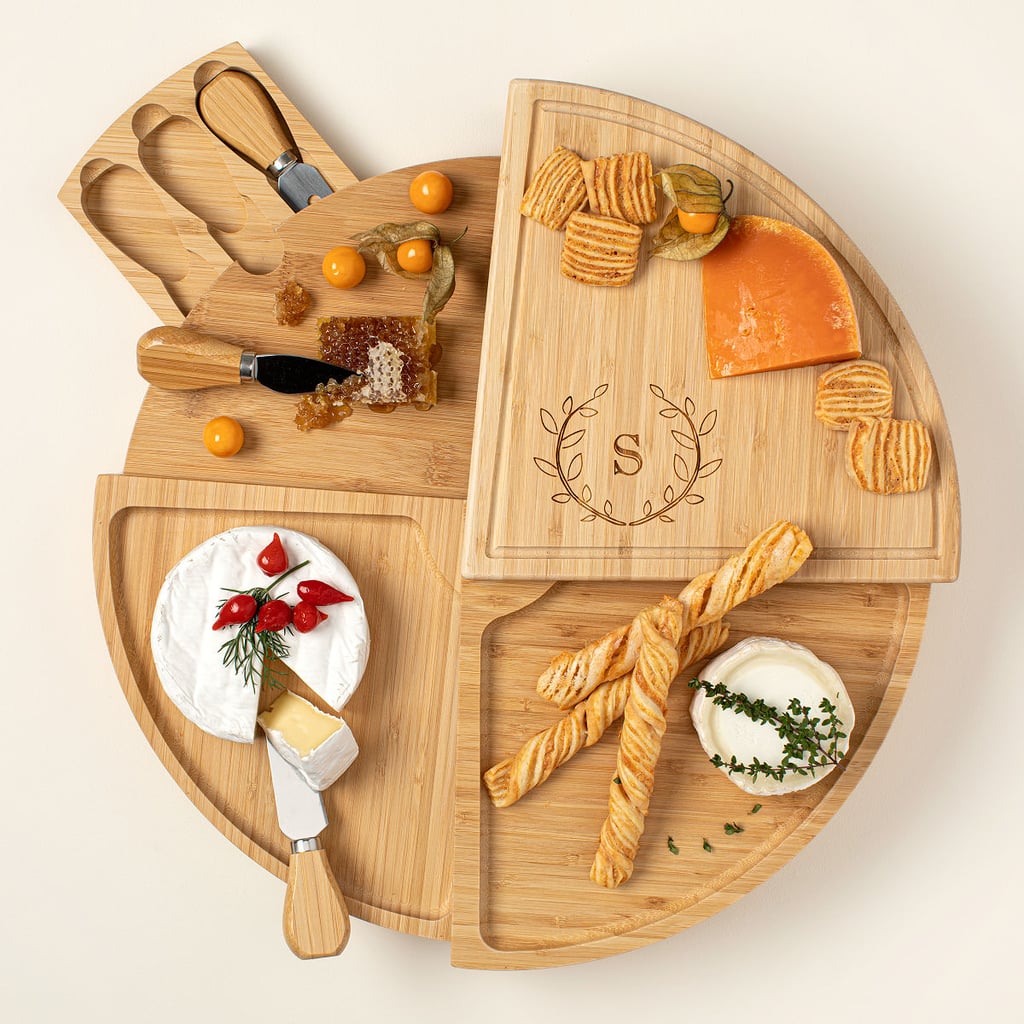 For the Ultimate Host: Uncommon Goods Personalized Compact Swivel Cheese Board